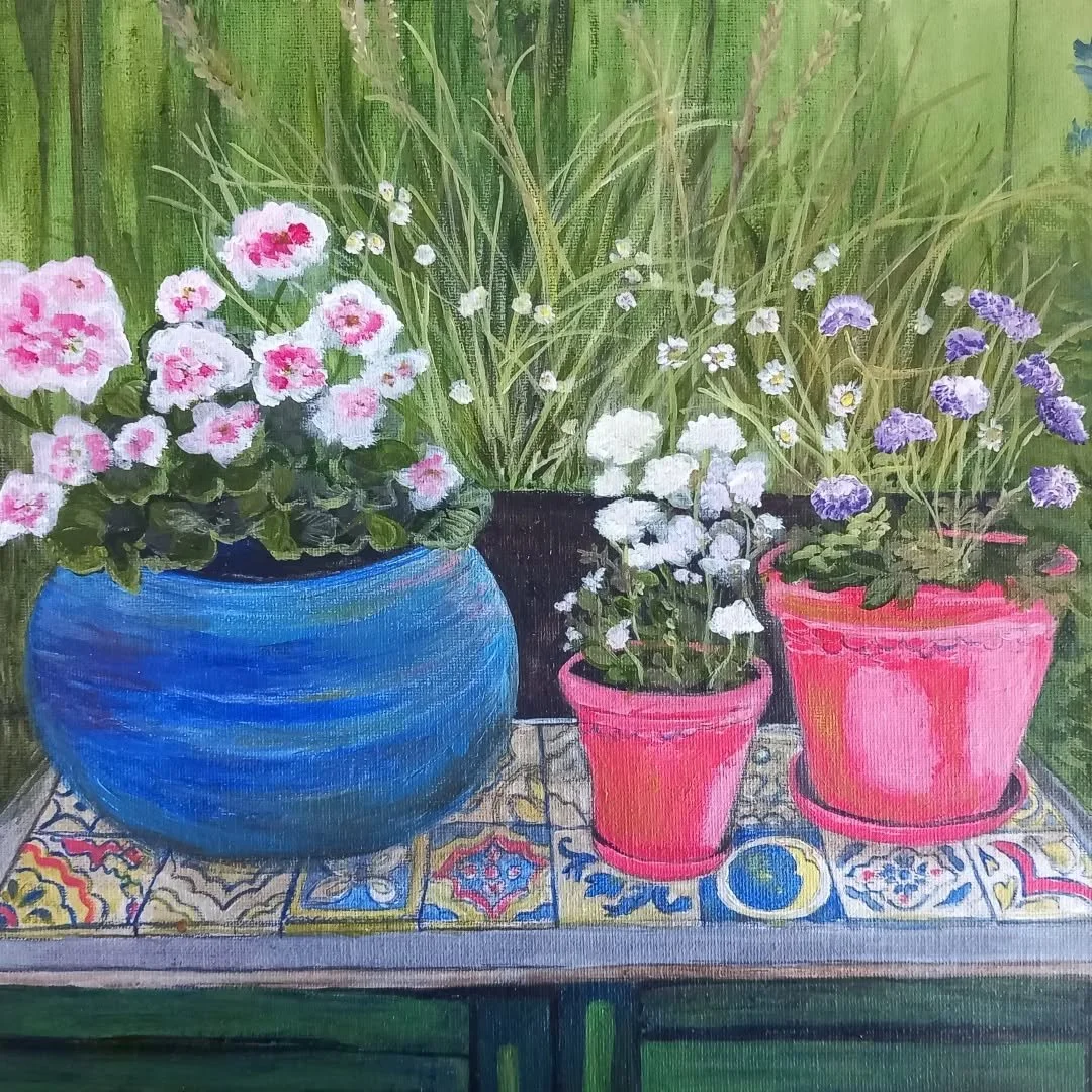 Summer pots on top of our welly cupboard