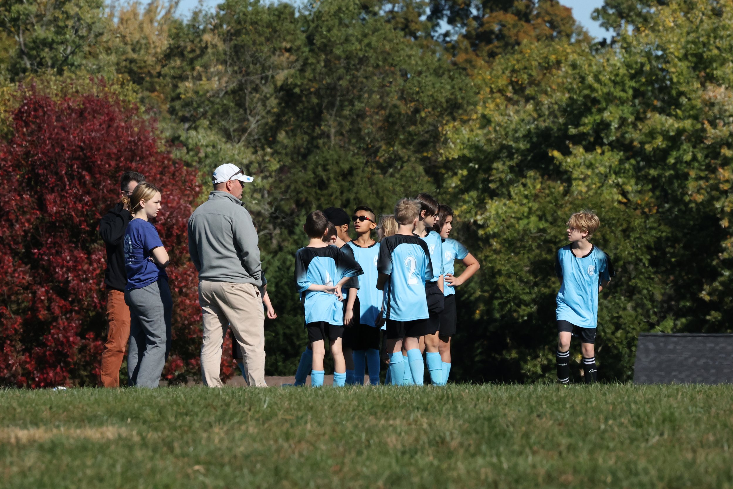  Coach Scott gives the boys a pep talk before the big game! 