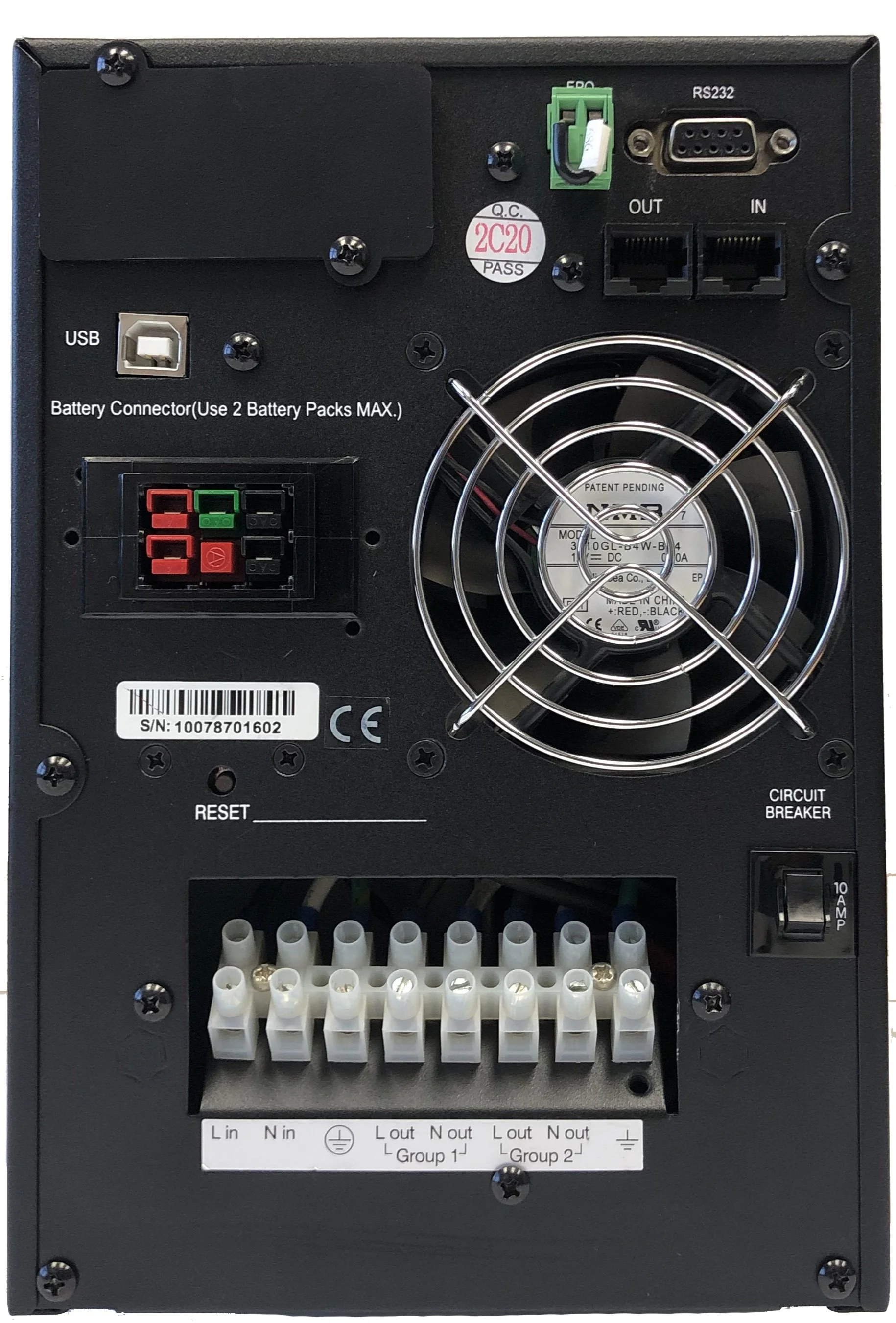 Interior of a black electronic device showing a cooling fan, various connection ports including USB and RS232, battery connector, circuit breaker switch, and terminal block with wire connections labeled for power and ground.
