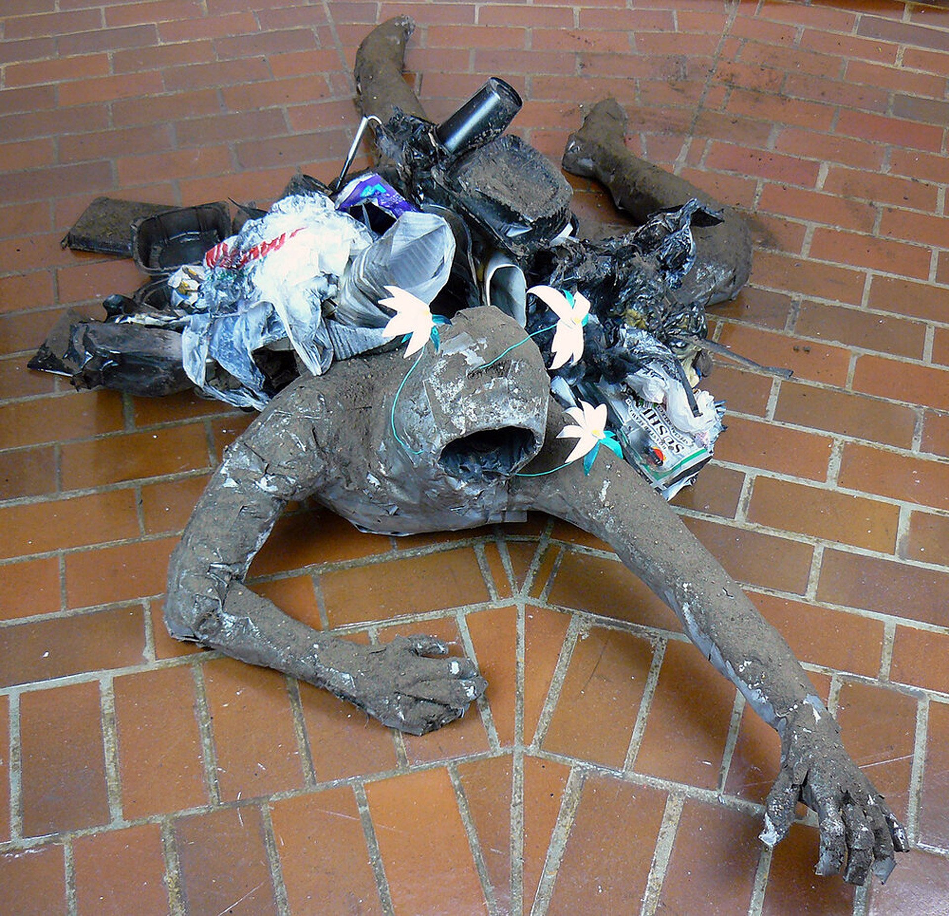 Plight of Industry II , duct tape, garbage, spray paint, and dirt, 33 x 25 x 32 inches, 2021.