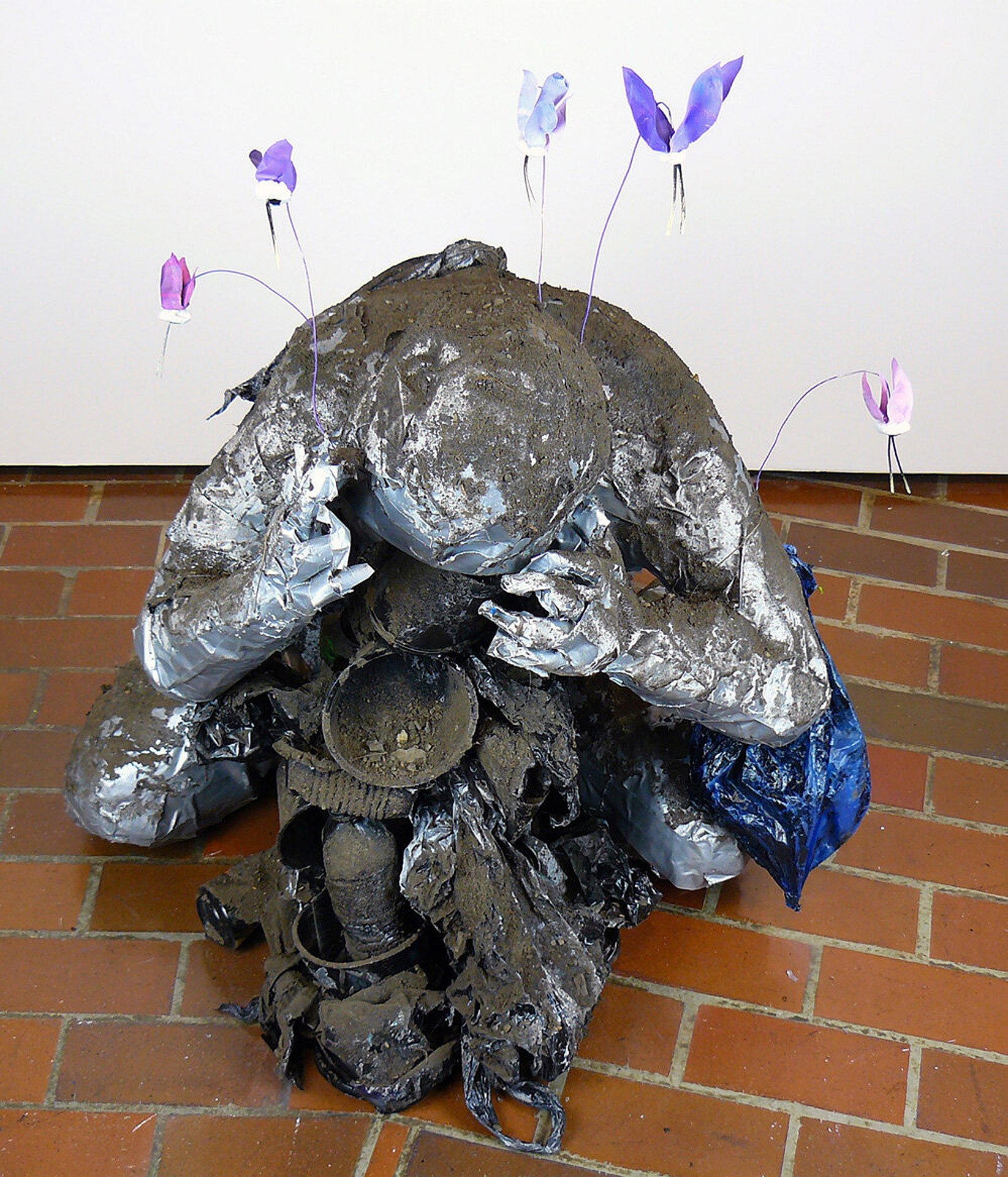 Plight of Industry I , duct tape, garbage, spray paint, and dirt, 33 x 25 x 32 inches, 2021.