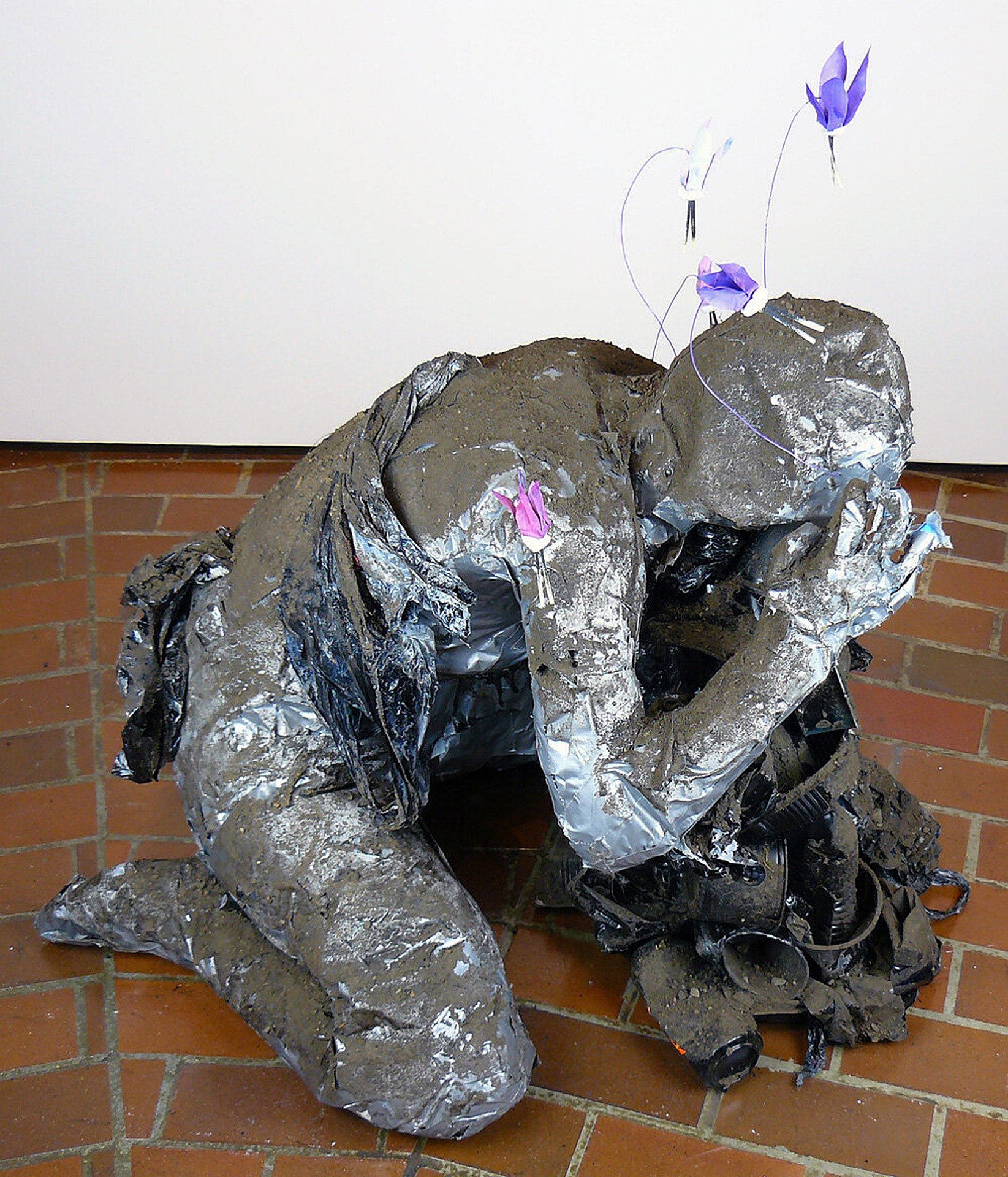 Plight of Industry I , duct tape, garbage, spray paint, and dirt, 33 x 25 x 32 inches, 2021.