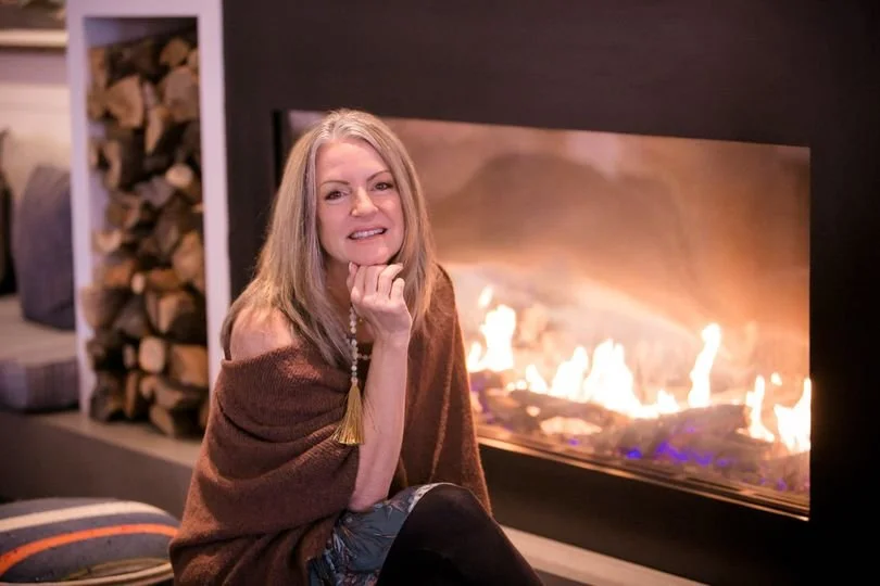 vicki by fireplace.jpg