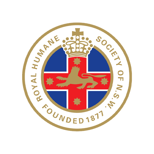 The logo for The Royal Human Society of NSW. Founded in 1877. Image of a red cross, blue background and a gold lion with a crown.