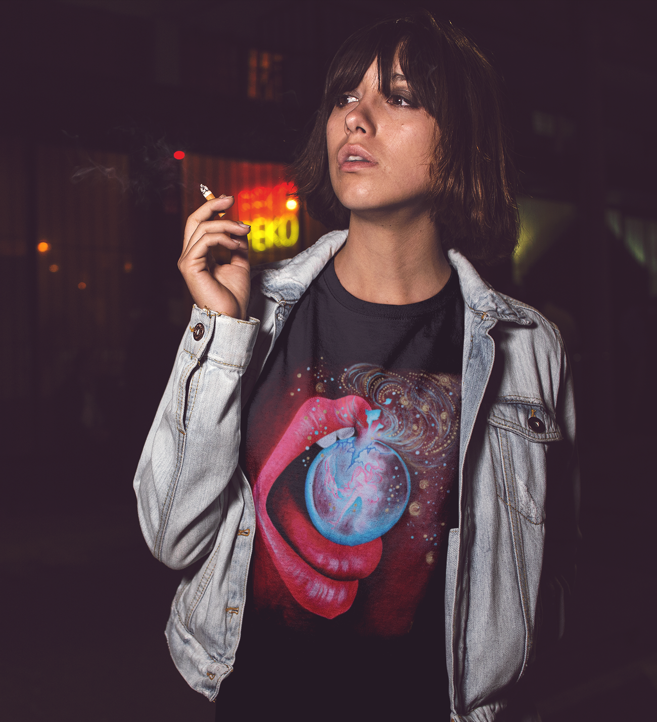 trenddy-girl-smoking-in-the-city-at-night-while-wearing-a-round-neck-tshirt-with-a-denim-jacket-on-top-a13564 (2).png