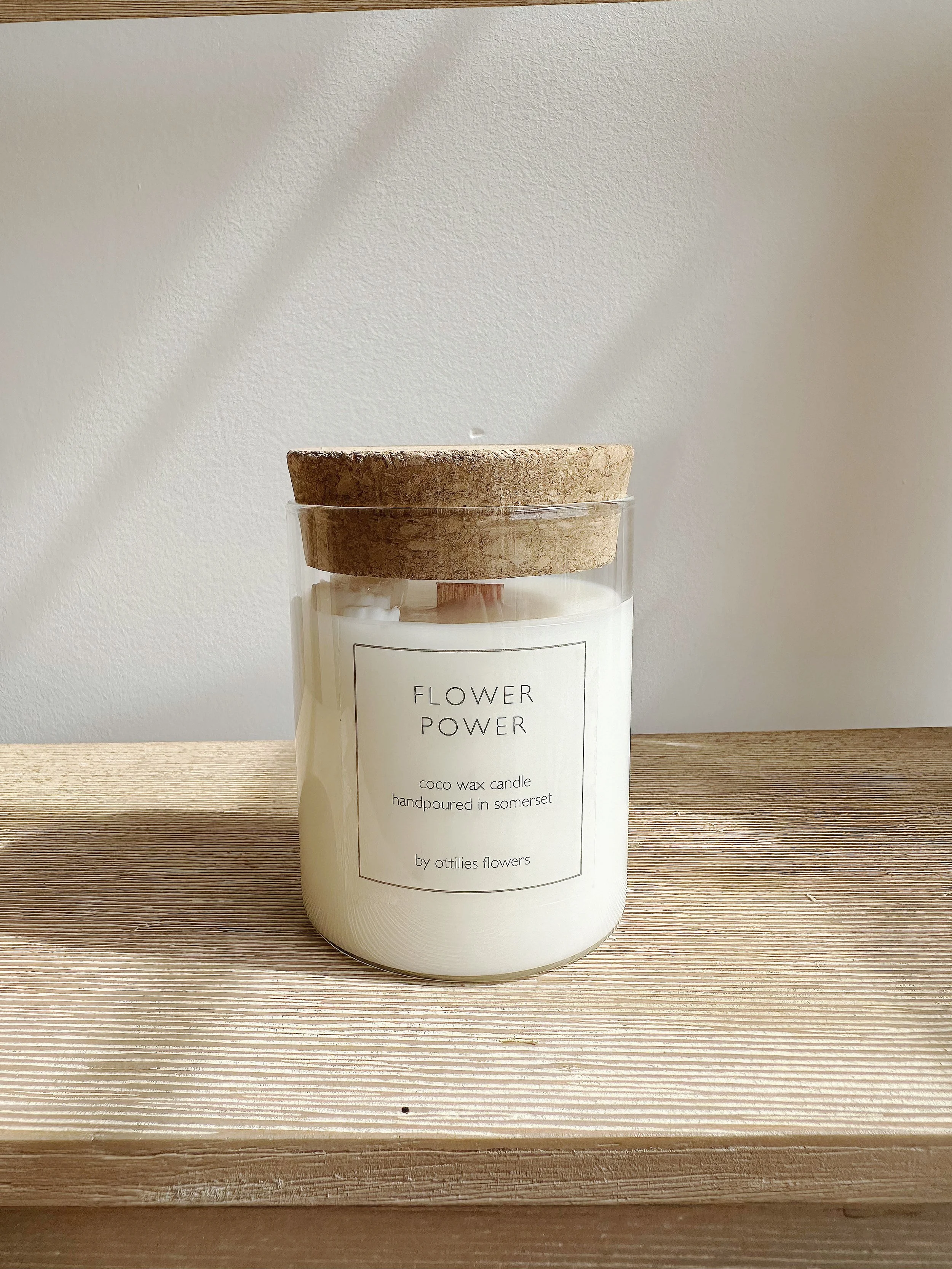 white candle with flowers on it