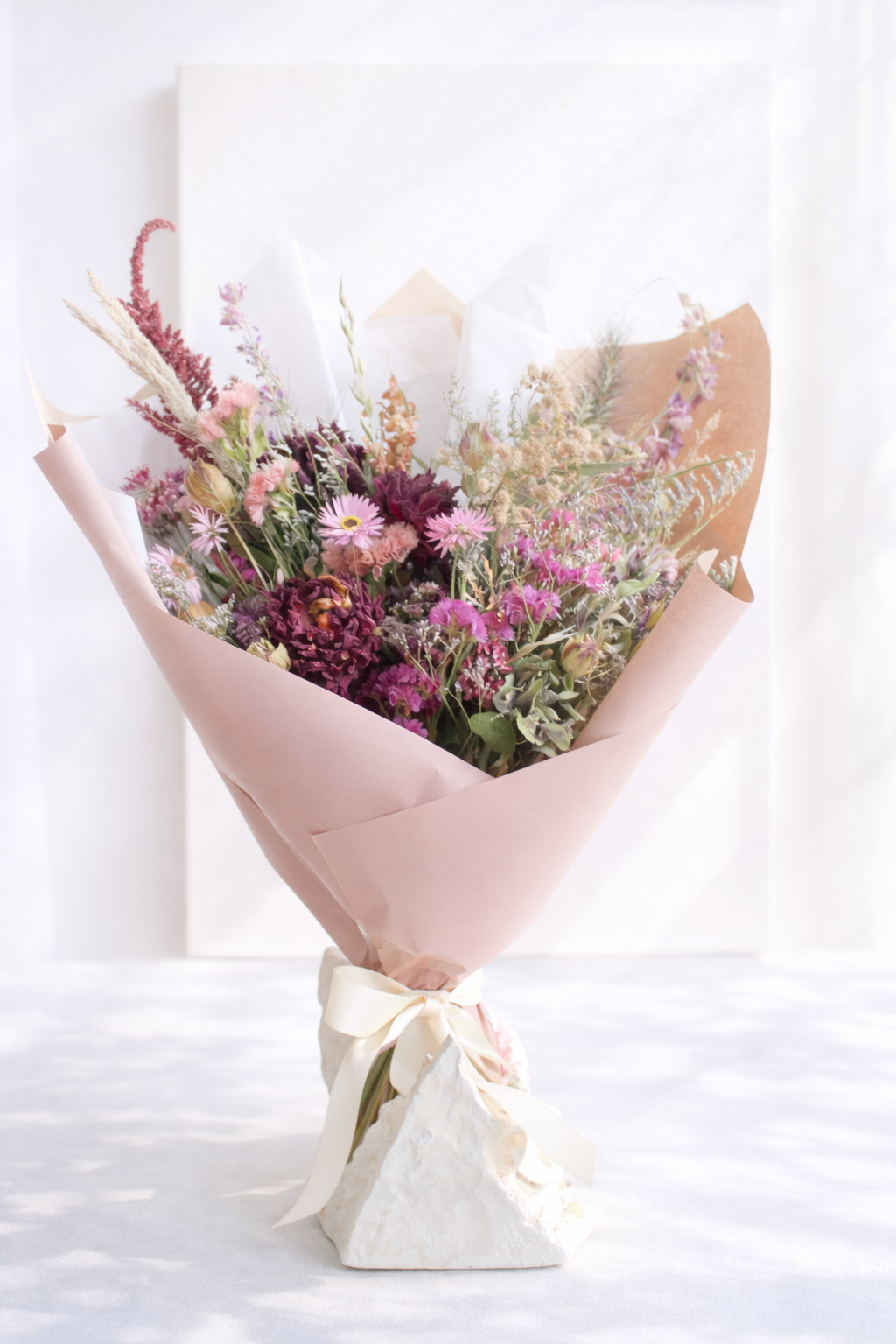 Dried flower bouquet in pink and purple