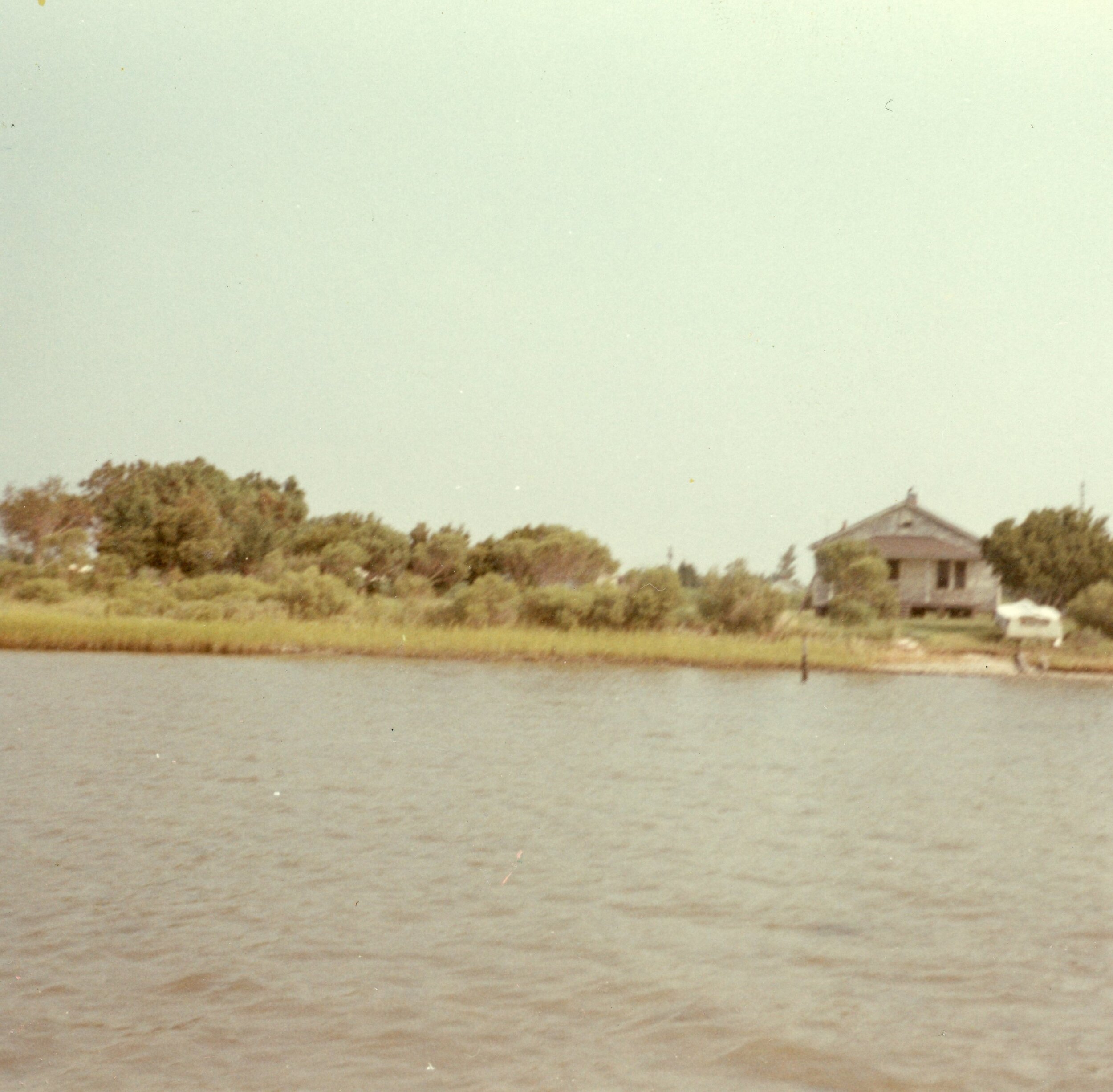 Photo taken from the water of David and Mamie’s lot on the left and Claude’s house on the right