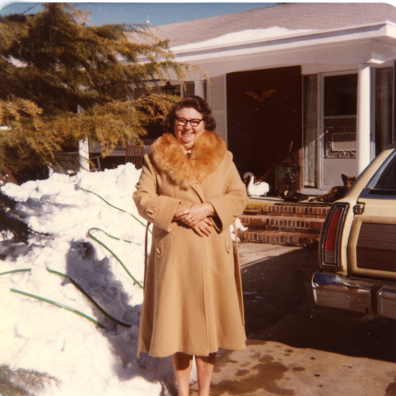 Mary Lee Rose, wife of Harkers Island boatbuilder James Rose, stands in front of their house, circa 1980s.