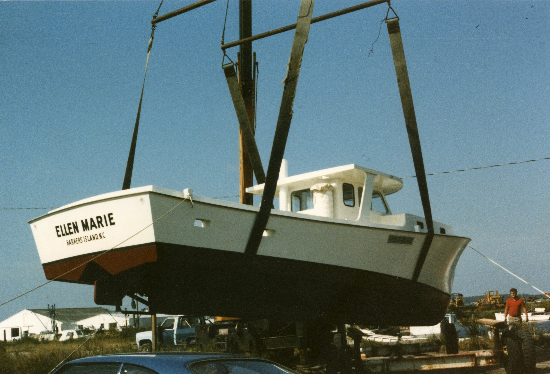 Dewey Piner’s crane putting the F/V Ellen Marie in the water, 1985