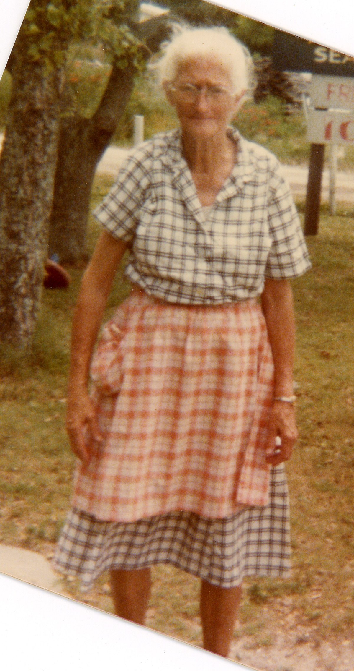 Ms. Alice Rose in her yard, 1970s.