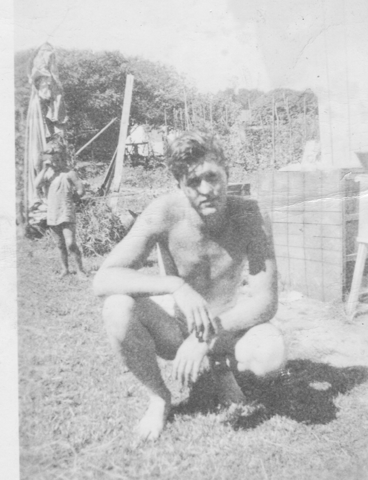 Donald Gray Guthrie in his early 20s in the back yard at 1210 Shackleford .Bobbie Dawn is crying for getting into trouble
