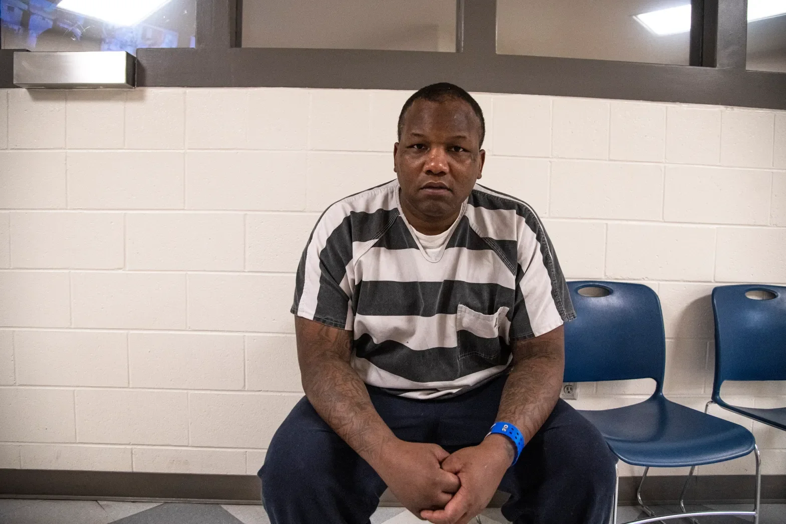 Lynell Brunner sits for a portrait inside a holding room within the Mesa County Detention Center in Grand Junction on Thursday, Oct. 3, 2024.