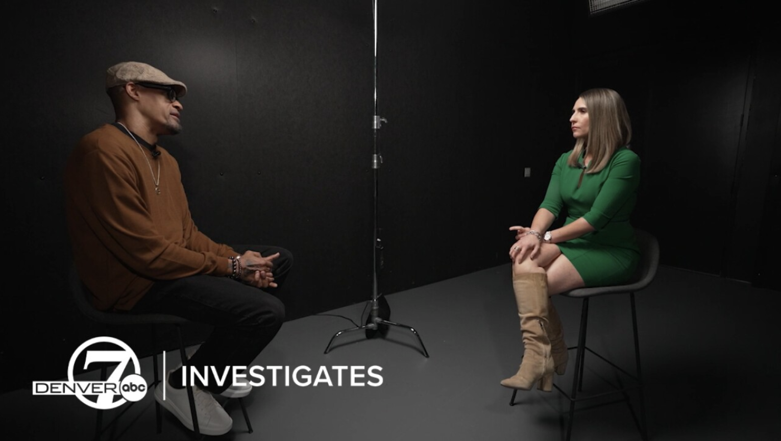 Man being interviewed by a woman
