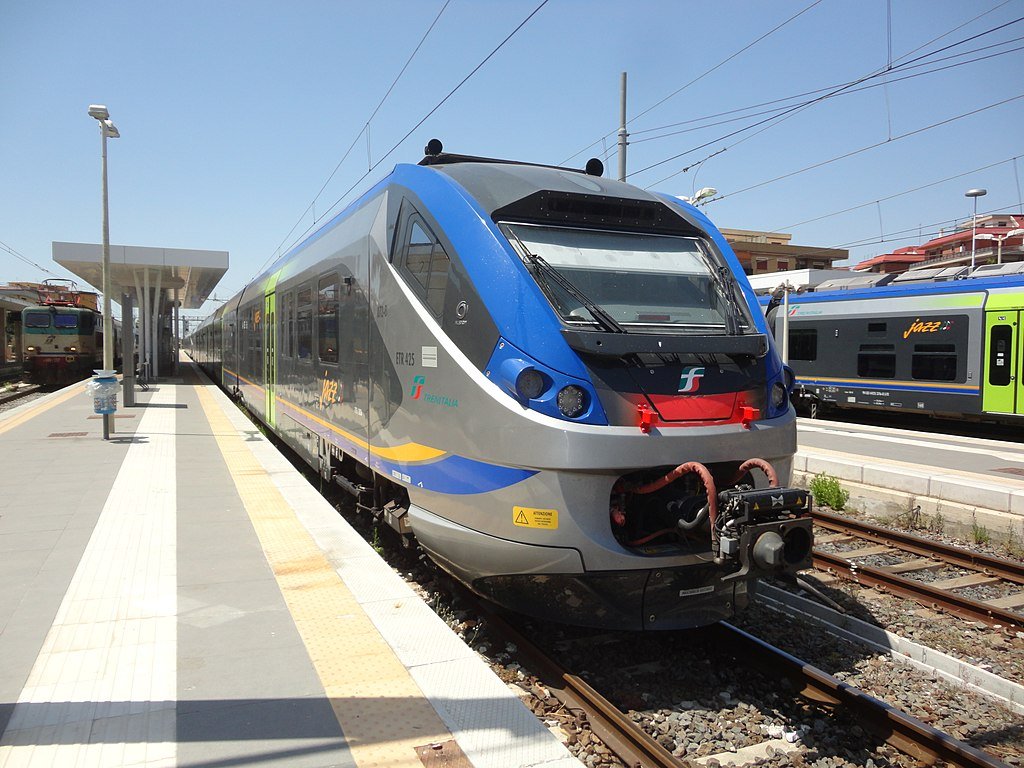 A regionale train stopped at a platform at a station somewhere in Italy