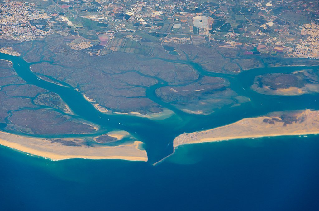 A distant aerial view of the wetlands and beaches that comprise the Reserva Natural da Ria Formosa in the Algarve.