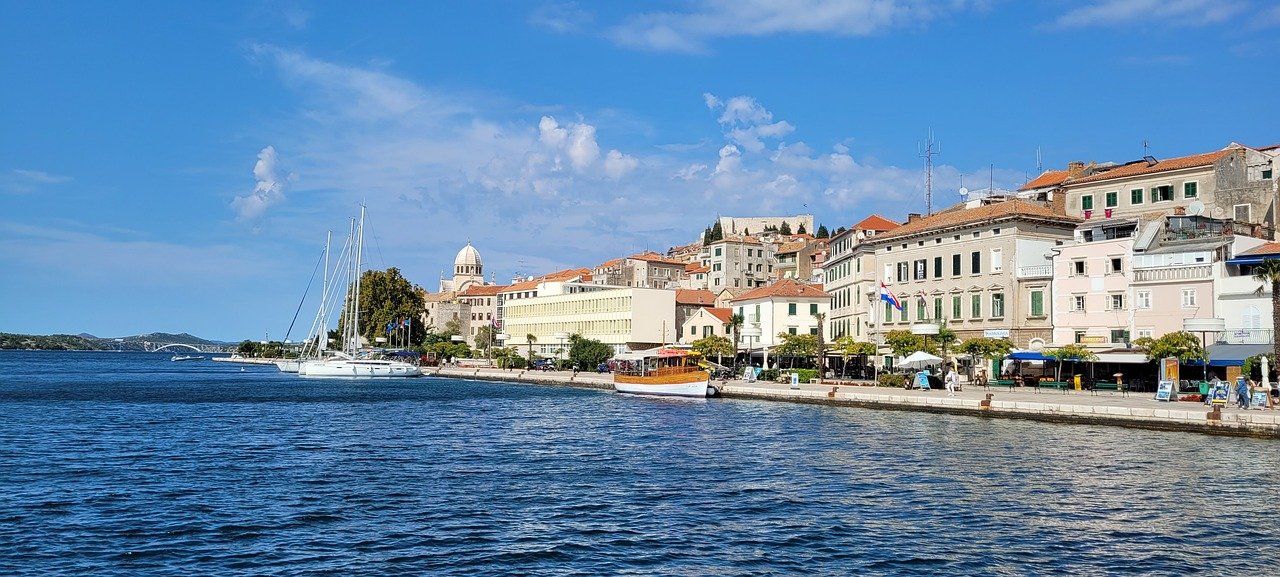The waterfront of the seaside town of Šibenik, Croatia with boats in the marina.