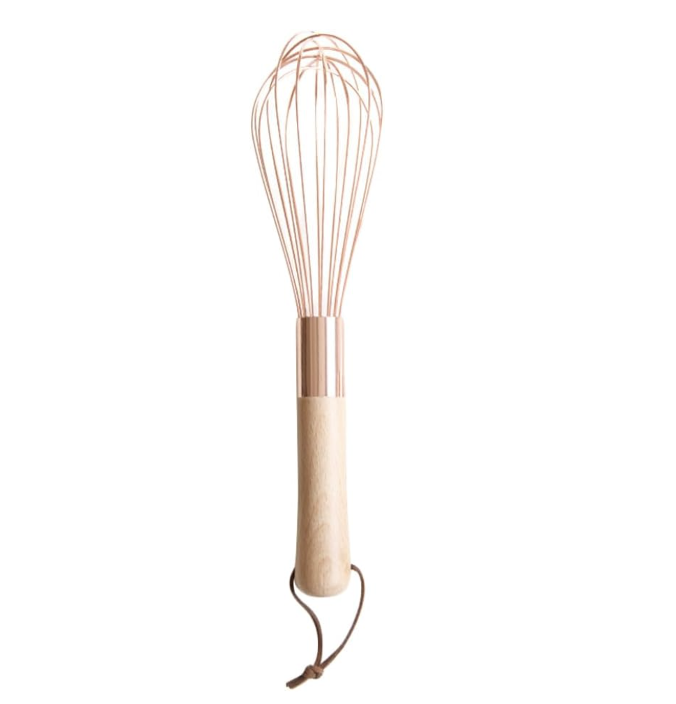 copper egg whisk with wooden handle
