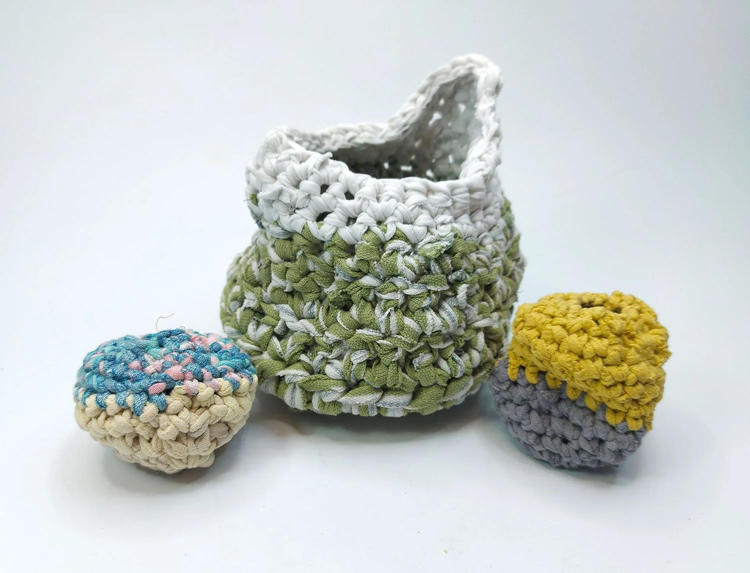 Handcrafted crochet baskets using upcycled clothing fabric.