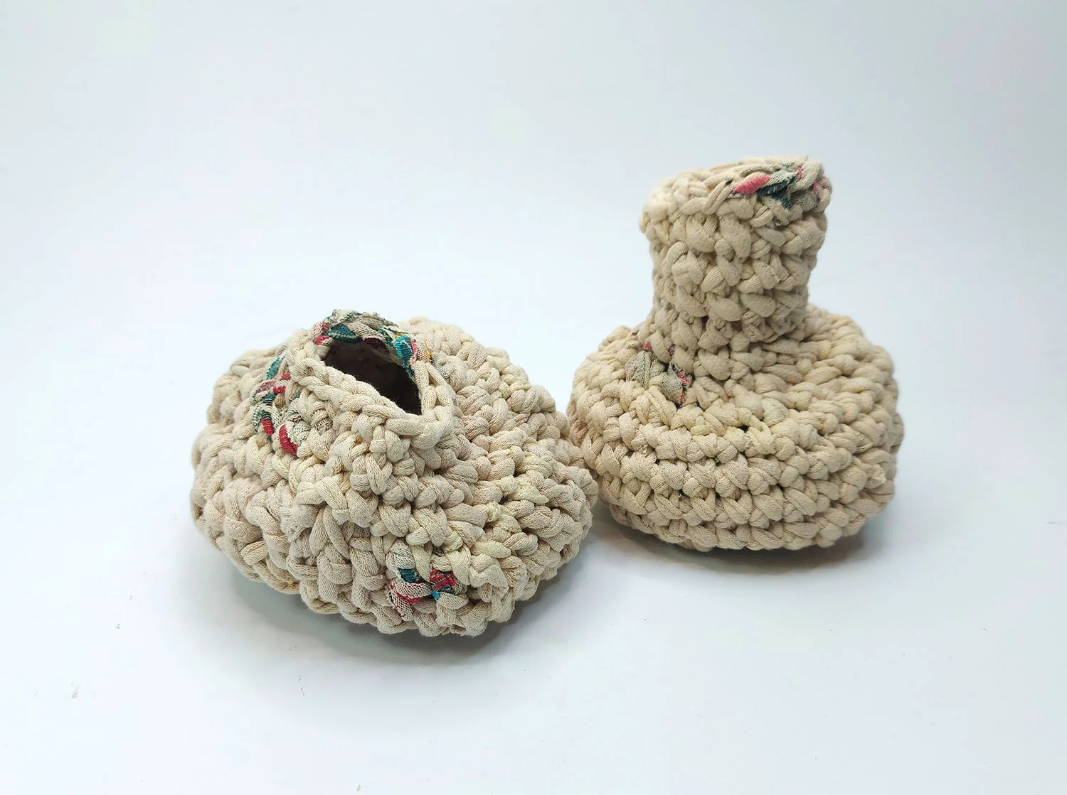 Two handmade fabric vessels, made from recycled clothes.