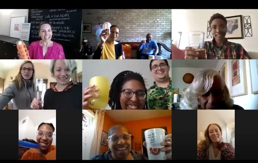 Group of adults smiling and waving over Zoom