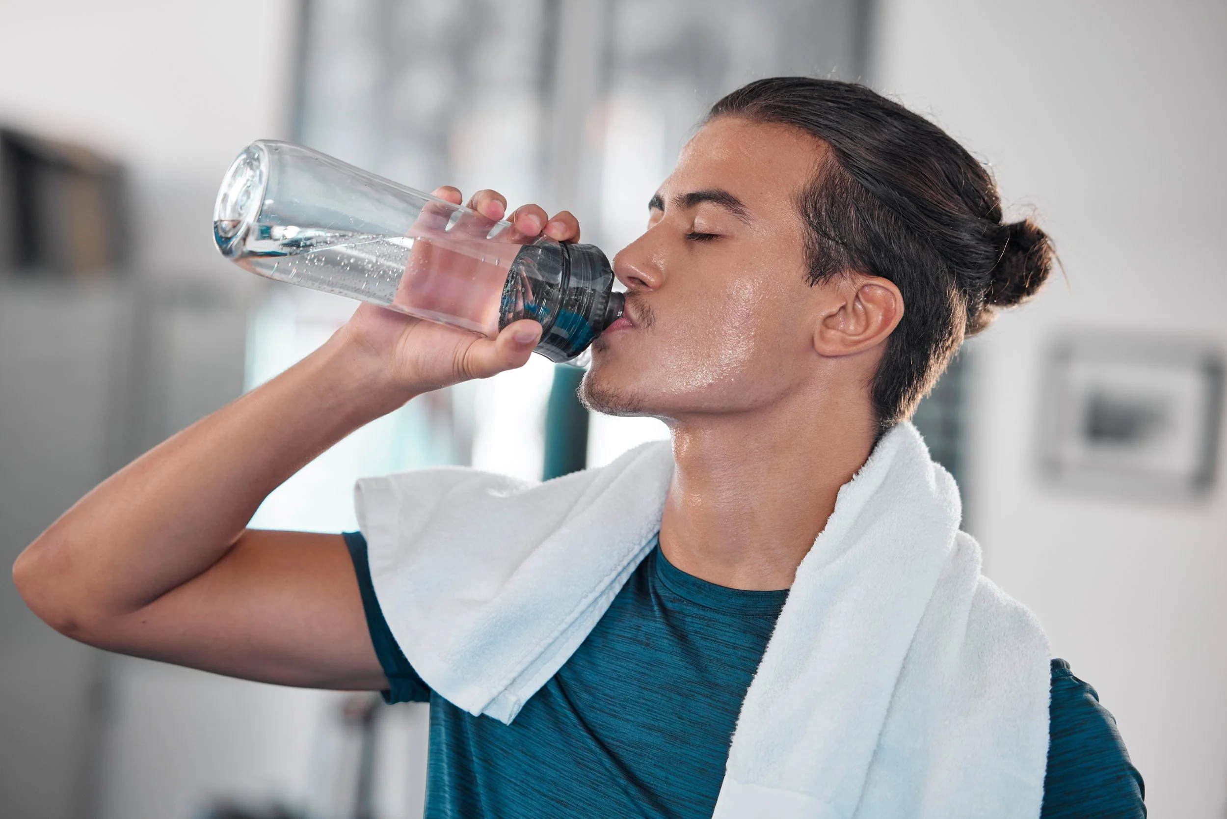 fitness-man-and-drinking-water-for-hydration-afte-2023-03-29-22-28-22-utc.jpg