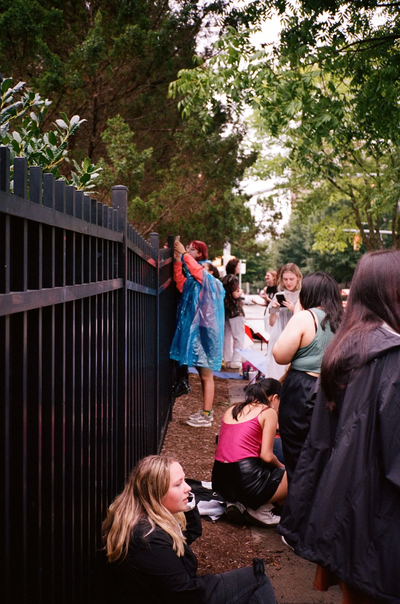 Climbing the fence to get a better view of soundcheck.