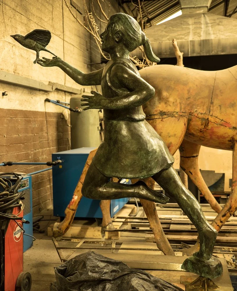 The figure photographed in the foundry before patination.
