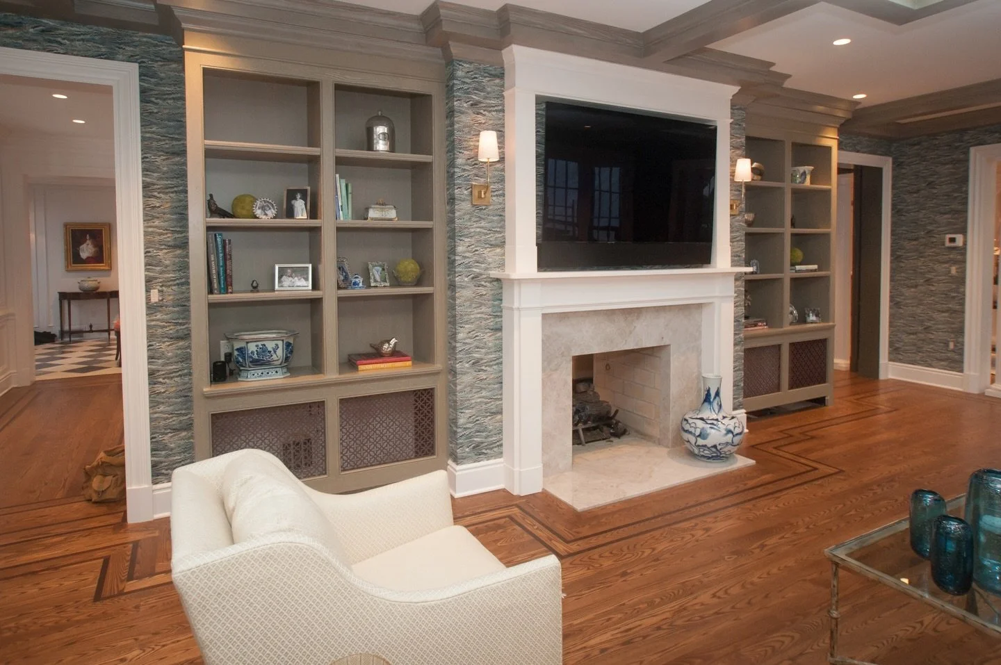 Crown moulding and coffered ceilings meet seamlessly for a refined, cohesive look.
#customcabinetry #pittsburghdesign #livingroom #cabinetry #cofferedceiling