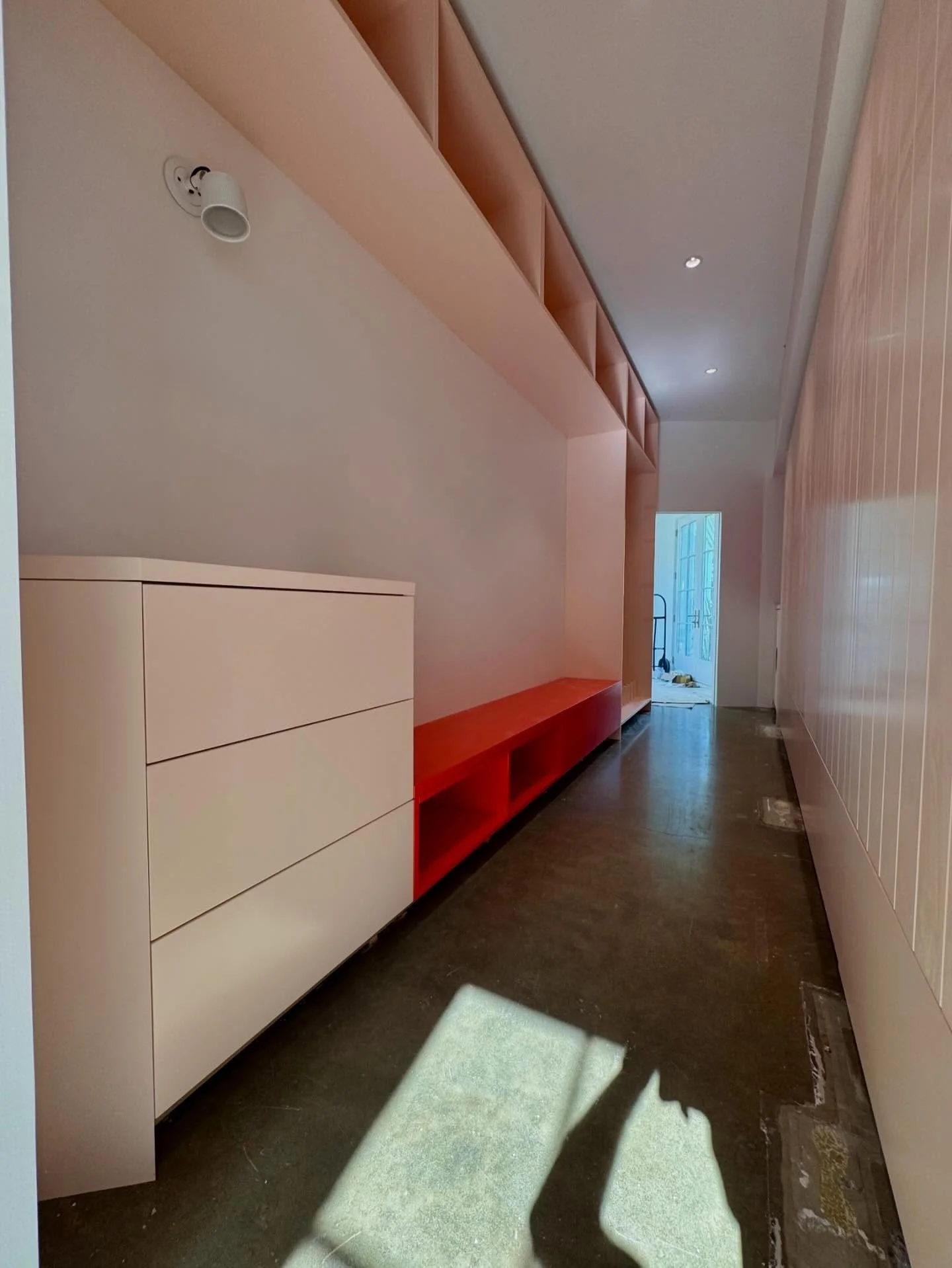 Bright and bold paint colors bring excitement to this very functional &ldquo;mudroom&rdquo; hallway.

Custom boot storage, bench, and closets will contain and organize all those seasonal items that need to be easily accessible. 
#custom #customcabine