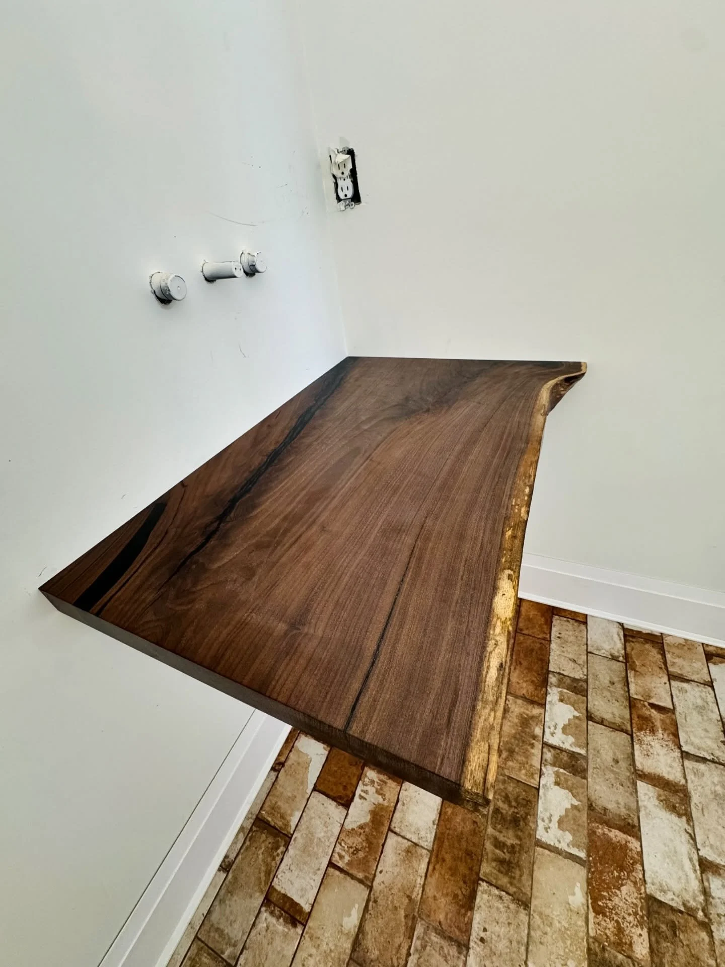 Powder room live edge walnut countertop that will hold a vessel sink. 

#custom #customcountertop #powderroom #liveedge #pittsburghdesign