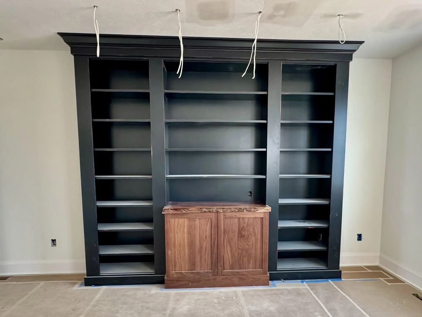 Custom bookshelves and a live edge walnut countertop with a  rub-through finish. 

#customwoodwork #custombookshelf #pittsburghdesign #liveedge #carpentry