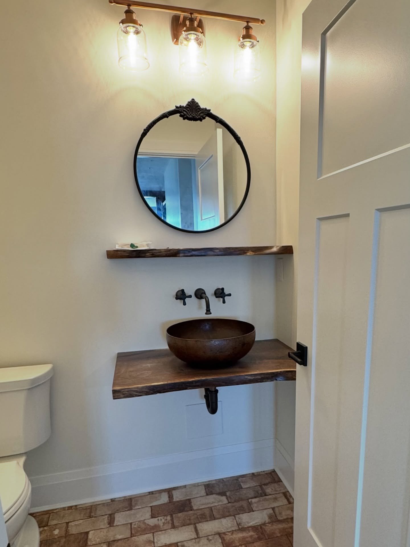 Floating, live edge powder room countertop and shelf. 

#bathroom #customwoodworking #pittsburghdesigner #powderroom #liveedge