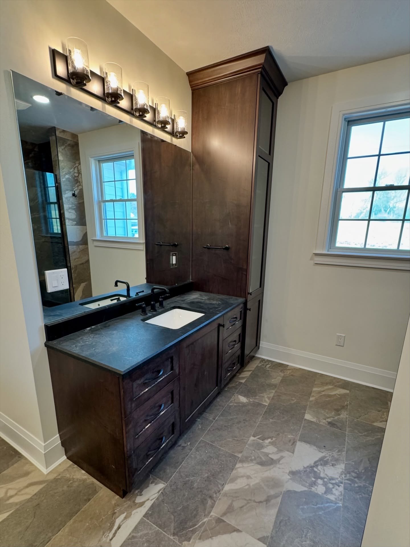 Matching bathroom vanities and floor to ceiling storage cabinet. 

#customwoodwork #pittsburghdesigner #cabinetry #customcabinetry #bathroomcabinets