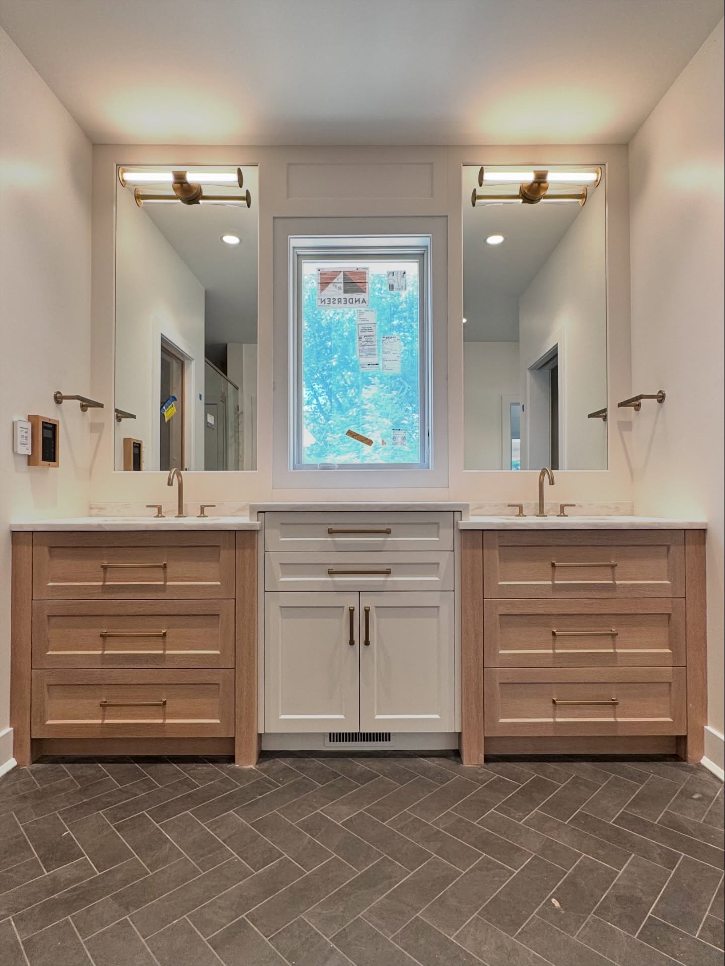 Finished up this bathroom elevation with framed mirrors, full-height moulding above the counters, and hardware. The waterfall countertops tie the his-and-her vanities together for a clean, cohesive look.

#custom #cabinetry #pittsburghdesign #bathroo