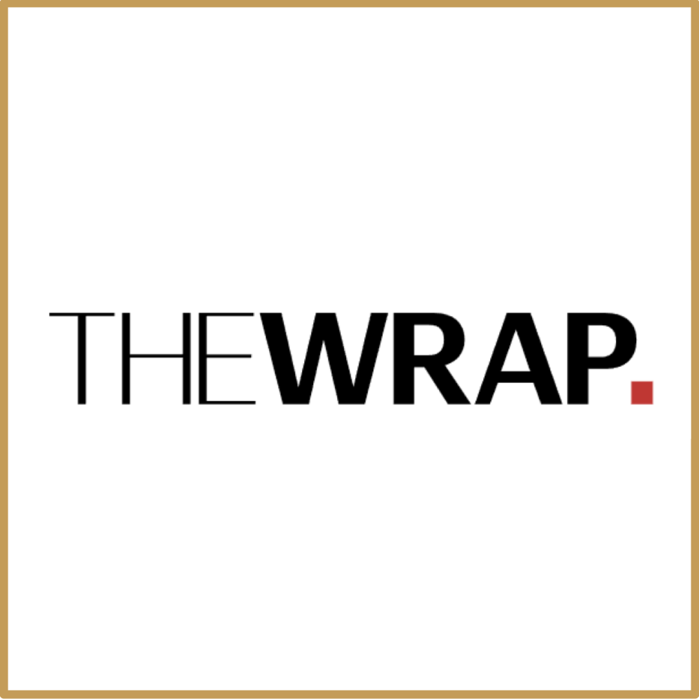 Typography graphic saying 'THE WRAP.' with a red period at the end, on a white background with a gold border.