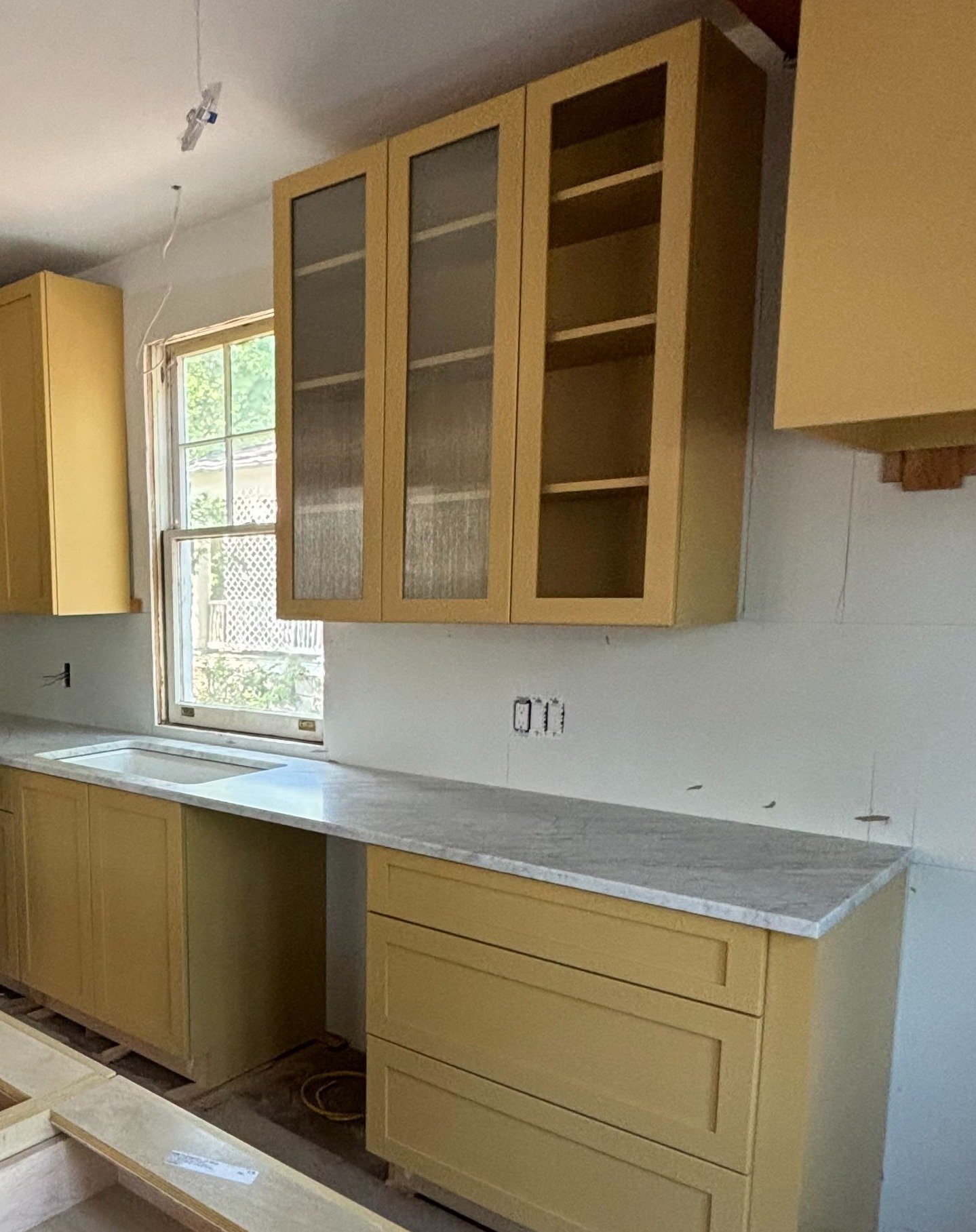 Our D.C. project is starting to look like a home! A sunny yellow kitchen adds warmth + a bold green fireplace brings a fun, unexpected element. Lot more fun to come... stay tuned #BTS

#takomapark #interiordesigners #yellowkitchen