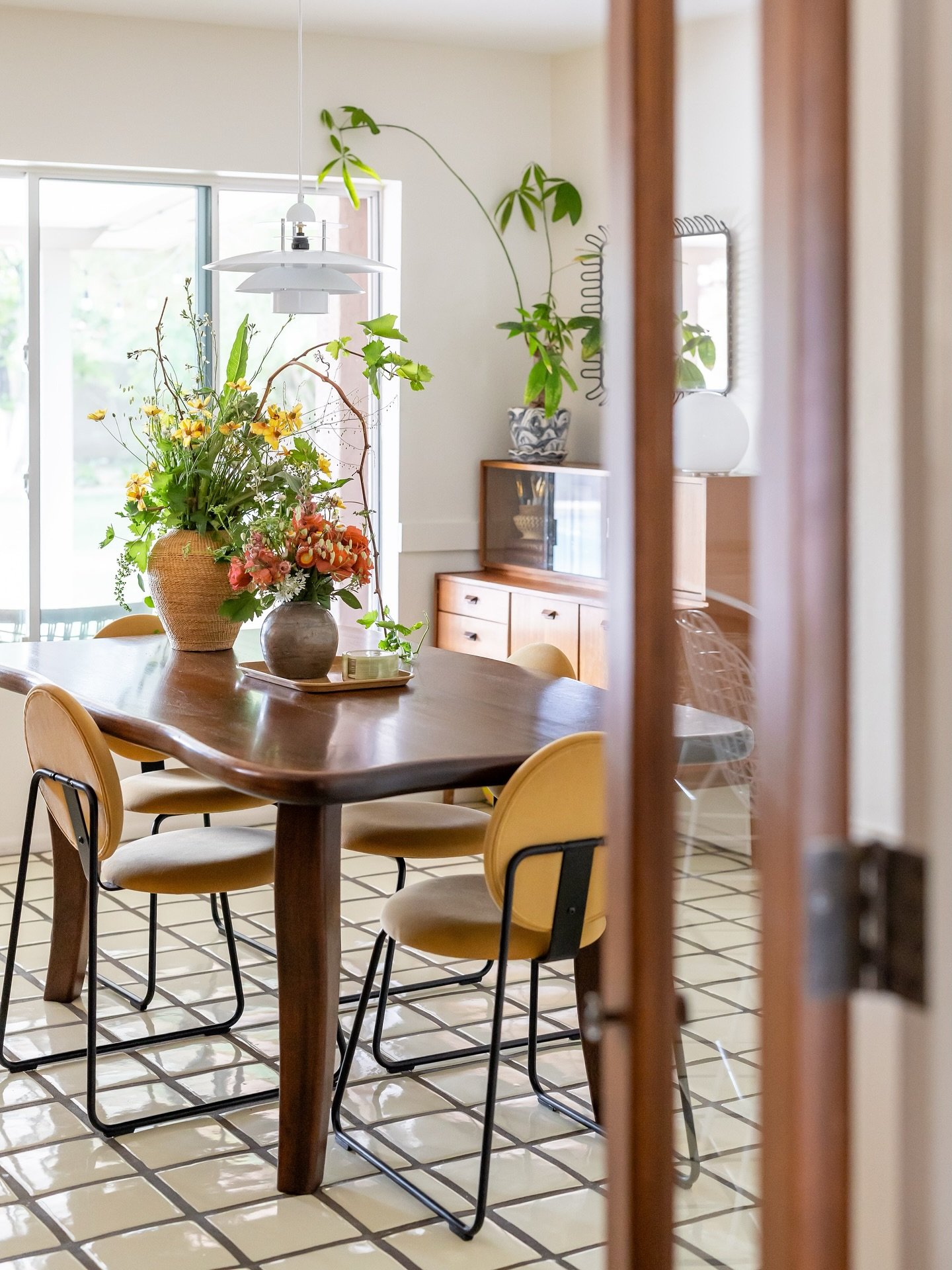 A custom dining table makes a statement + adds character, while the IKEA chairs keep things fun + casual. It&rsquo;s a an eclectic mix that just works.