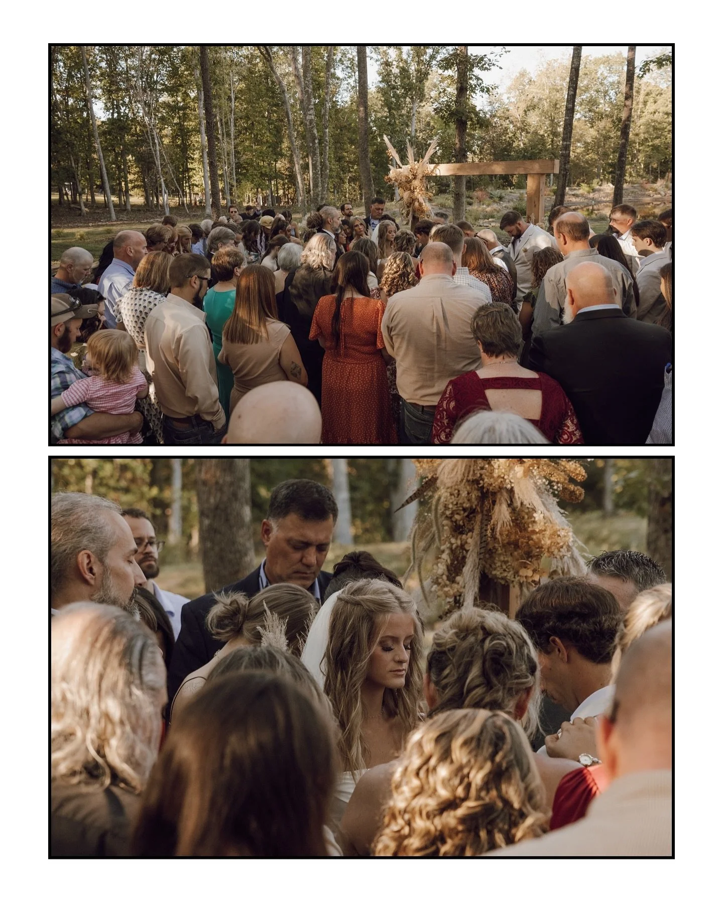 An outdoor wedding ceremony with a large group of guests gathered around a bride and groom, with trees in the background and a decorated arch behind them.