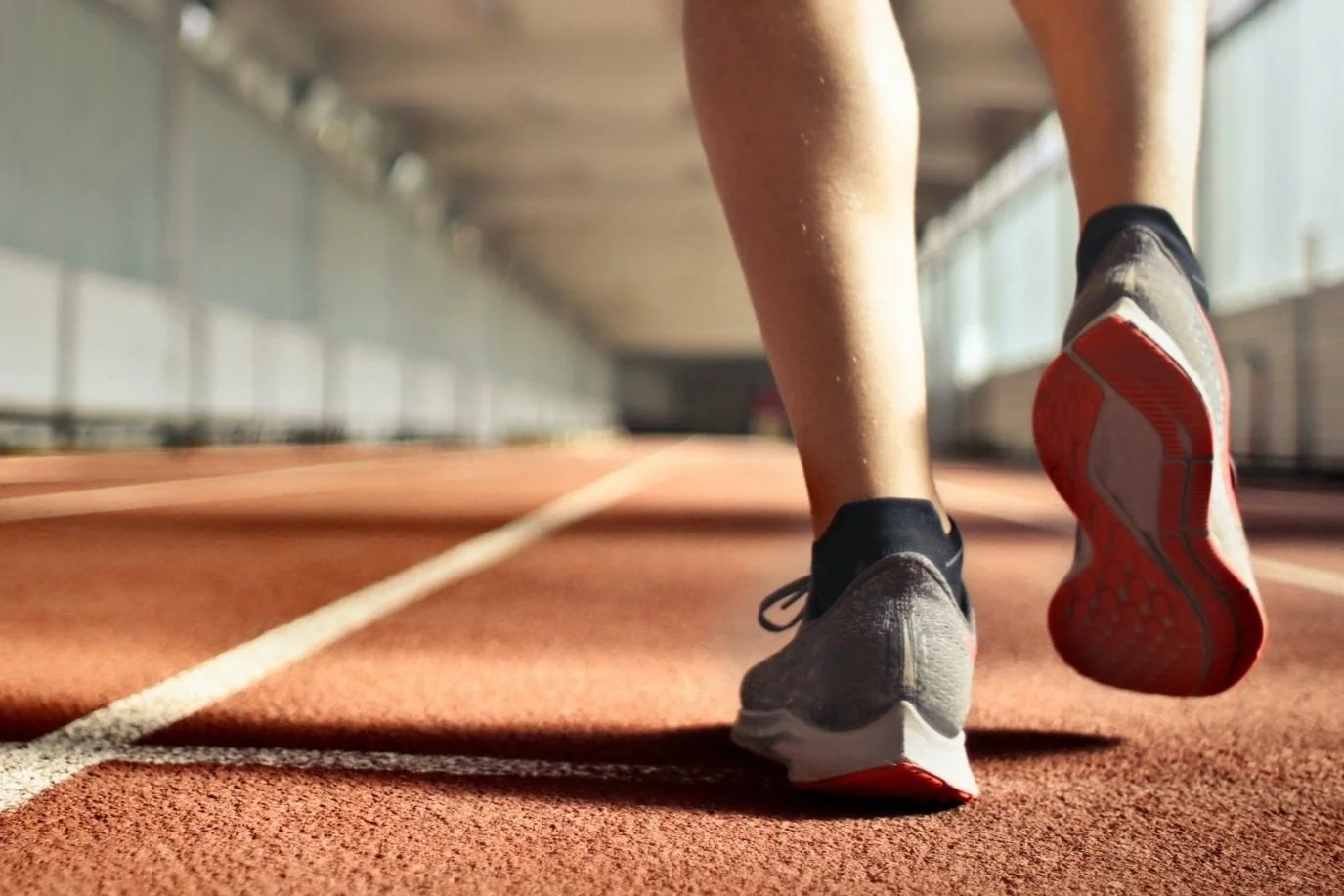 spotting disordered eating in athletes blog post, track athlete going for a run