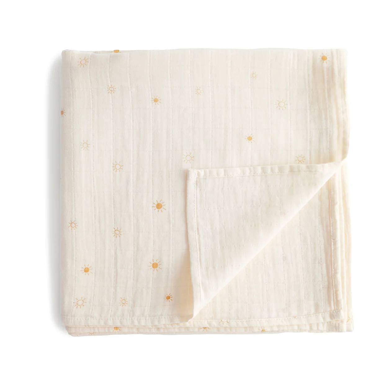 A cotton muslin swaddle with yellow suns folded into a square.