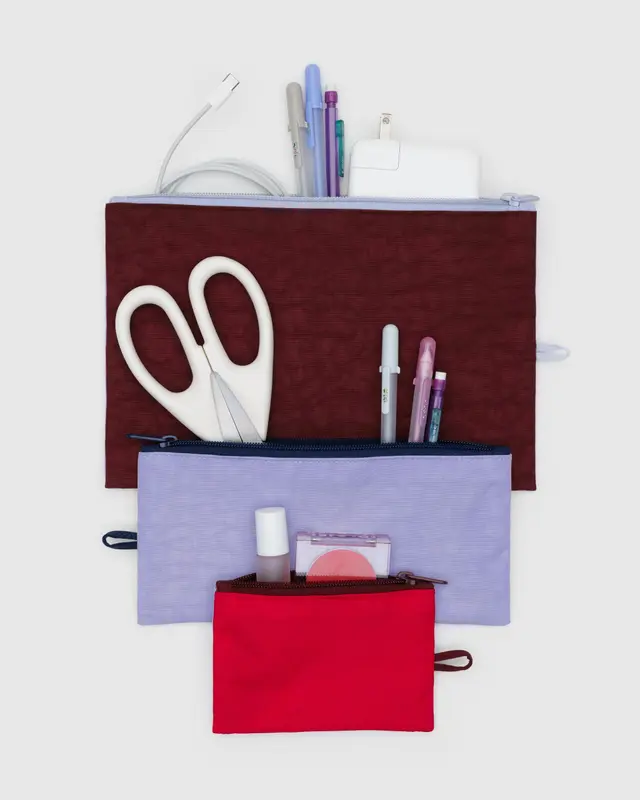 Baggu Kaleidoscope Mix Flat Pouch Set, each filled with various office supplies.
