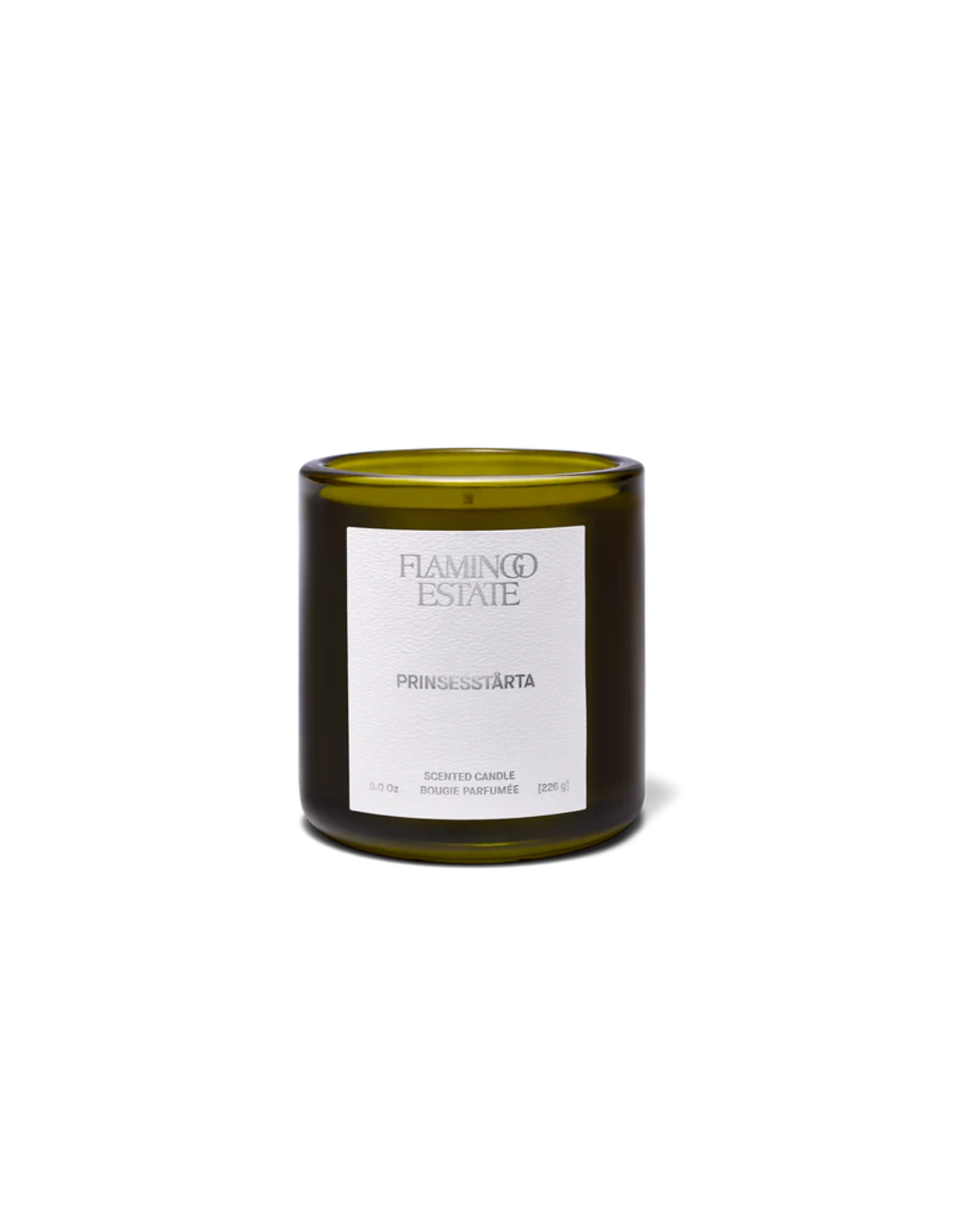 Flamingo Estate Prinsesstarta Candle, a vegetable wax candle in a dark green glass vessel, with a simple white label.