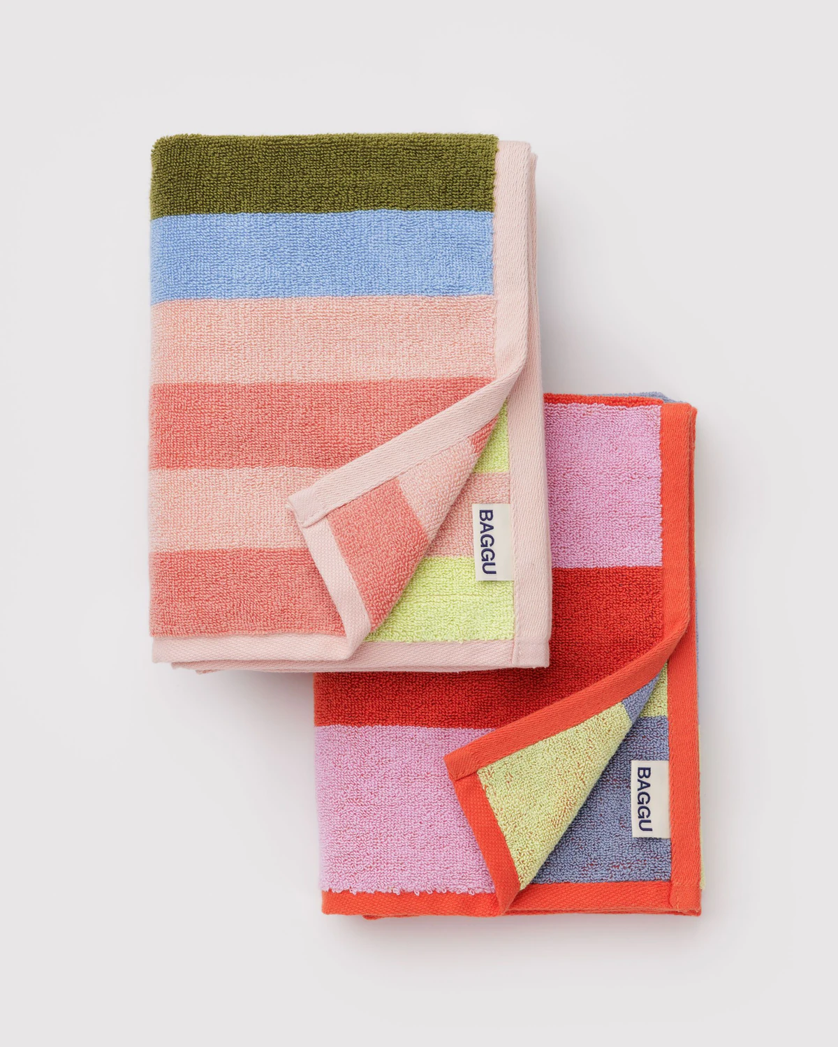 Baggu Striped Mix Hand Towels, colorful striped towels folded with their corners folded over to reveal tags with the word "BAGGU".