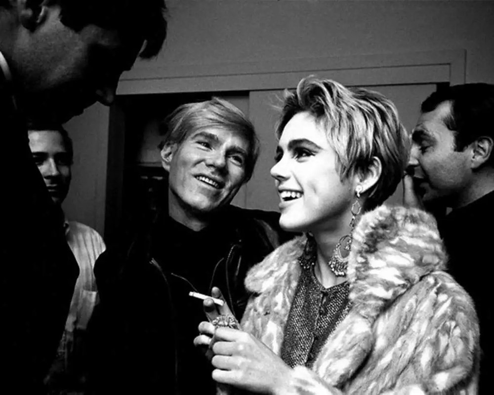 andy-warhol-looks-adoringly-at-edie-sedgwick-fur-coat.jpg