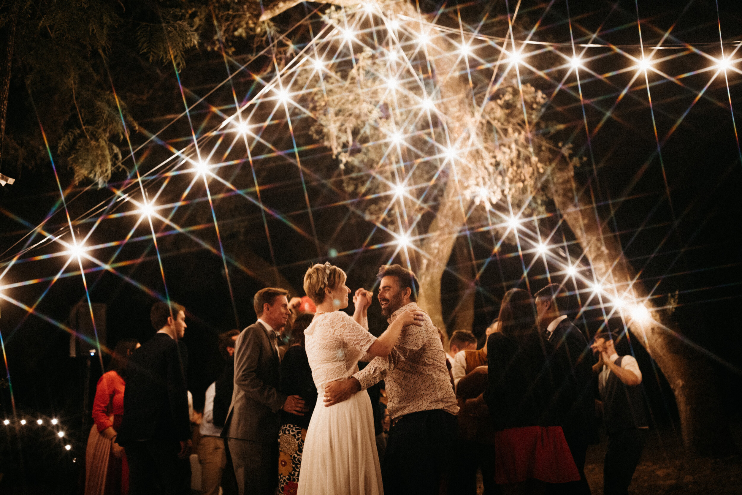 married couple dancing wedding reception twinkle lights in Calistoga San Francisco Sonoma Napa wedding photographer by Andrea Vodickova