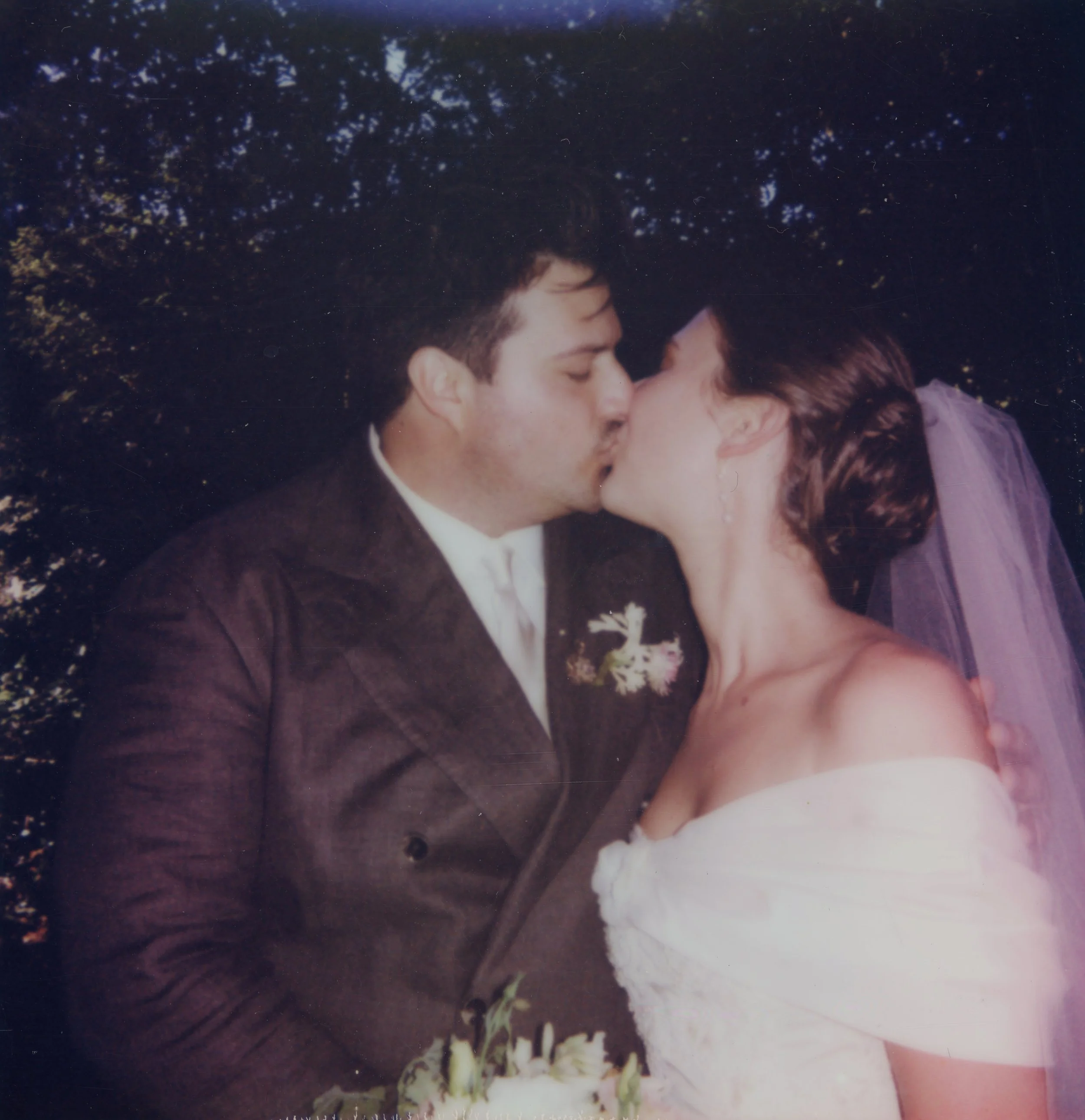 newlywed couple kissing on Polaroid at Outdoor Art Club Mill Valley San Francisco California wedding and elopement photographer Super 8 Polaroid film video by Andrea Vodickova