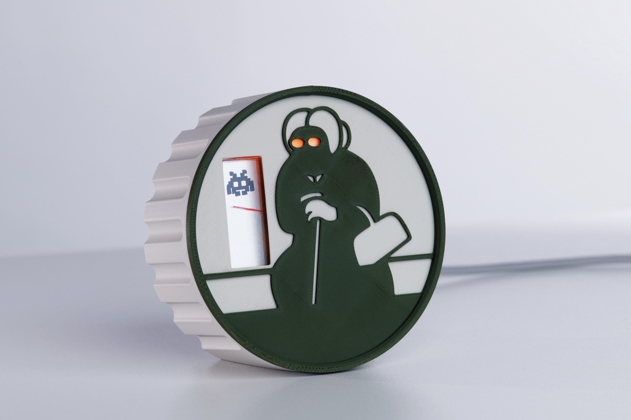 A security camera Alarm. Needle and glowing eyes to indicate approaching problem