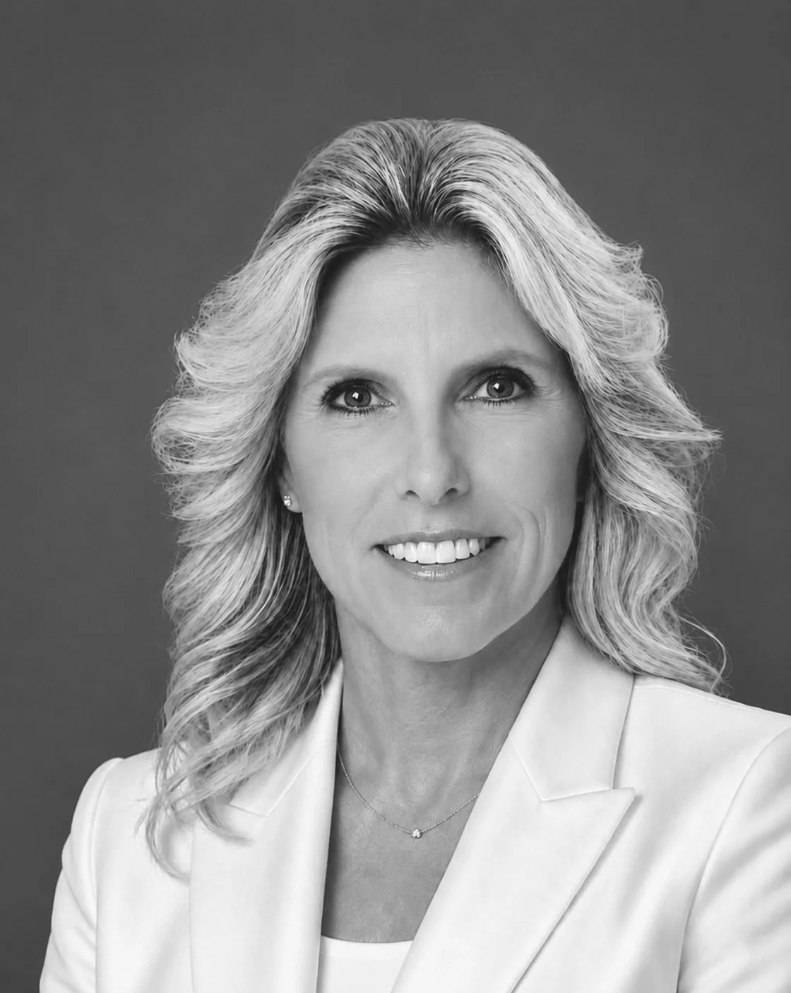 Black and white professional headshot of Senior Executive Assistant Pamela Pellegrino.