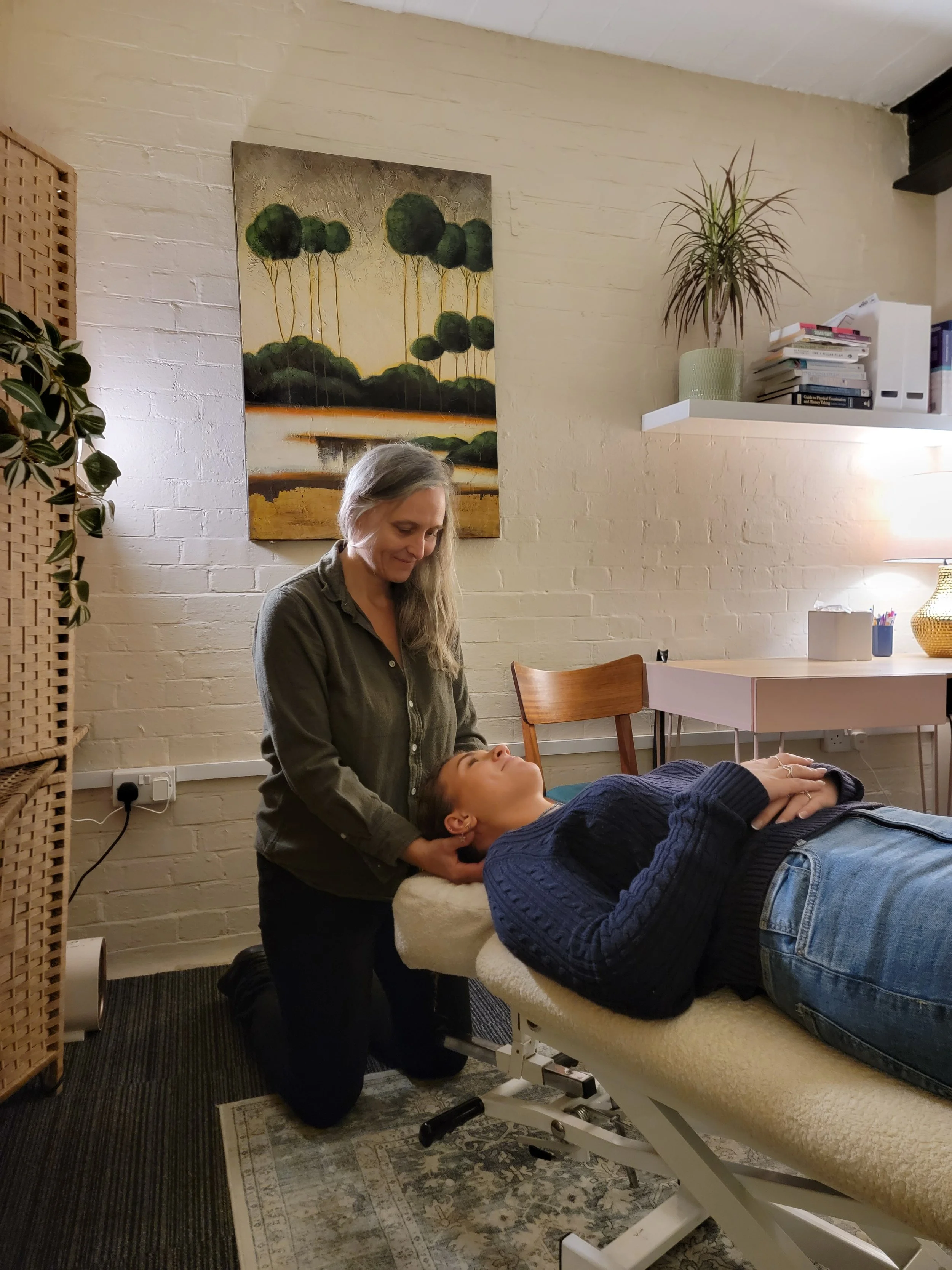 Melody Mussell giving a gentle McTimoney chiropractic treatment